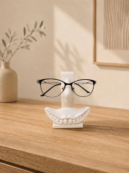 Funny face eyeglasses holder on a wooden desk